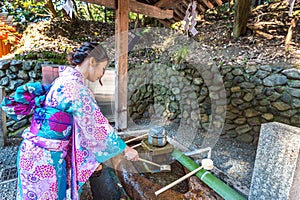 Asian women in traditional japanese kimonos at Fushimi Inari Shrine in Kyoto, Japan