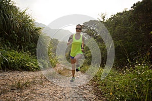 Asian woman trail running