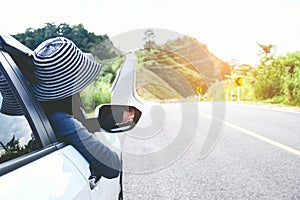 Asian woman traveler with car on beautiful road