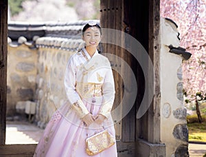 Asian woman traveler in traditional korean dress or hanbok dress