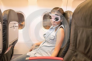 Asian woman traveller sleeping in the airplane