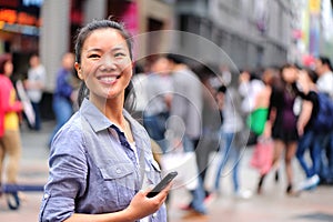 Asian woman use cellphone at shopping street