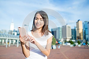 Asian woman use of mobile phone in Hong Kong