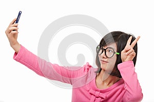 Asian woman using a cell phone to take a selfie isolated on white background