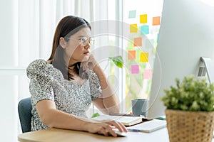 Asian woman using a computer working at home office, Asia businesswomen Video Conference online via the internet with technology