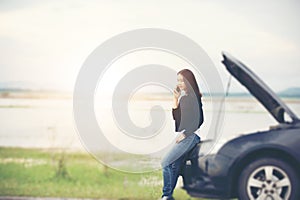 Asian woman using mobile phone while looking and Stressed man si