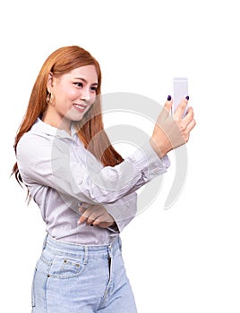 Asian woman using mobile smartphone for selfie ,video chat , face time or video call with smiling face. studio shot