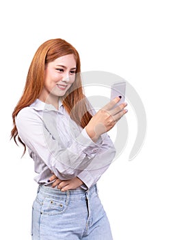 Asian woman using mobile smartphone for selfie ,video chat , face time or video call with smiling face. studio shot isolated