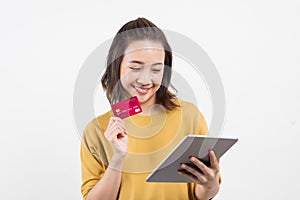 Asian woman using  tablet and credit card