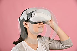 Asian woman using vr glasses, Watching movie and playing video games from virtual reality headset