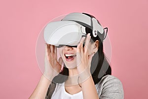 Asian woman using vr glasses, Watching movie and playing video games from virtual reality headset.