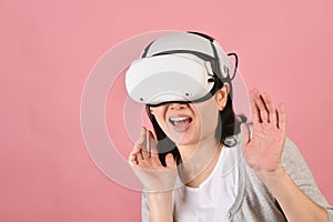 Asian woman using vr glasses, Watching movie and playing video games from virtual reality headset, Young woman amazed