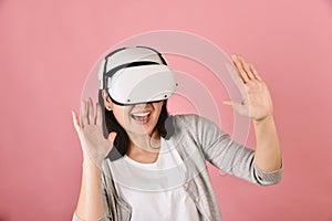 Asian woman using vr glasses, Watching movie and playing video games from virtual reality headset, Young woman amazing