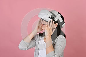 Asian woman using vr glasses, Watching movie and playing video games from virtual reality headset, Young woman amazing