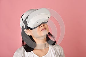 Asian woman using vr glasses, Watching movie and playing video games from virtual reality headset, Young woman amazing