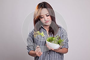 Asian woman very hate salad.