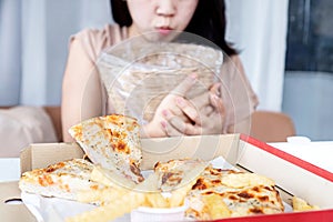 Asian Woman Vomiting and Indigestion Due to Overeating Pizza, bulimia, concept