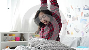 Asian woman wakeup in morning and stretching arms