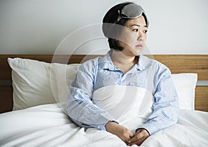 An asian woman waking up
