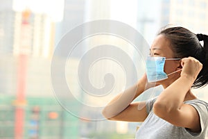 Asian woman wear face mask in city