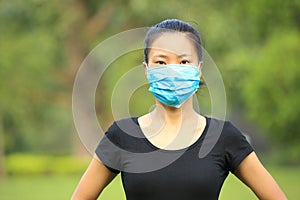 Asian woman wear face mask in city