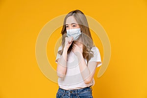 Asian woman wear masks to protect disease on yellow background