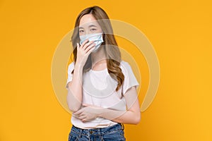 Asian woman wear masks to protect disease on yellow background