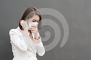 Asian woman wear protective face mask in pollution city with coughing