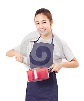 Asian Woman Wearing Apron And Showing Pot With Utensil.