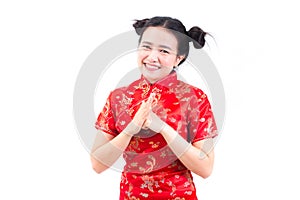 Asian woman wearing chinese dress cheongsam with gesture of cong