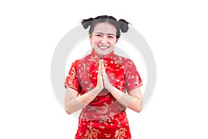 Asian woman wearing chinese dress cheongsam with gesture of cong