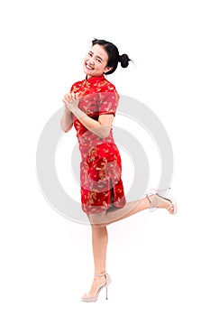 Asian woman wearing chinese dress cheongsam with gesture of cong