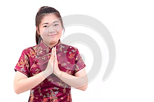 Asian woman wearing chinese dress cheongsam with gesture of congratulation,