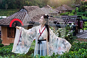 Asian woman wearing chinese traditional dress at Ban rak thai village in mae hong son province, Thailand