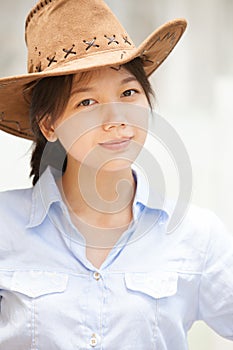 Asian woman wearing a hat