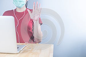 Asian woman wearing hygiene protective mask to protect COVID19, making facetime video calling with smartphone at home, social