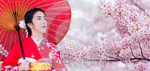 Asian woman wearing japanese traditional kimono and cherry blossom in spring, Japan