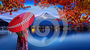 Asian woman wearing japanese traditional kimono at Fuji mountain. Autumn at Kawaguchiko lake in Japan