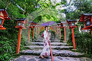 Asian woman wearing japanese traditional kimono at Kifune Shrine in Kyoto, Japan