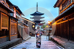 Asian woman wearing japanese traditional kimono at Yasaka Pagoda and Sannen Zaka Street in Kyoto, Japan