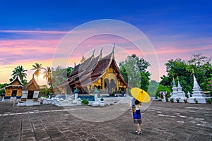 Asian woman wearing laos traditional at Wat Xieng Thong Golden City Temple in Luang Prabang, Laos