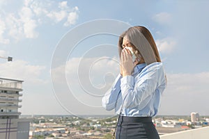 Asian woman wearing mask sick and pollution in the city PM2.5