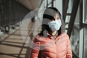 Asian woman wearing medical mask at public place