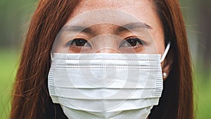 An asian woman wearing protective face mask for Healthcare concept