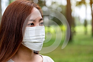 An asian woman wearing protective face mask for Healthcare concept