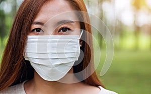 An asian woman wearing protective face mask for Healthcare concept