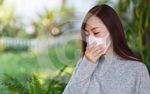 An asian woman wearing protective face mask for Healthcare and Covid-19 or 2020 virus concept