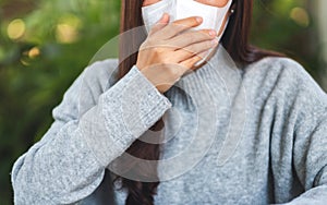 An asian woman wearing protective face mask for Healthcare and Covid-19 concept