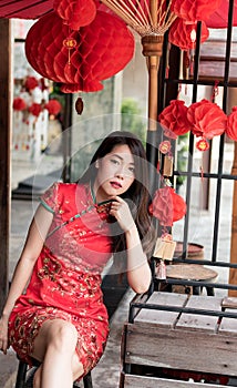 Asian woman wearing red traditional dress in chinese new year festival