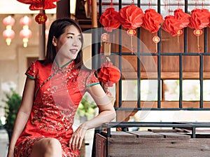 Asian woman wearing red traditional dress in chinese new year festival